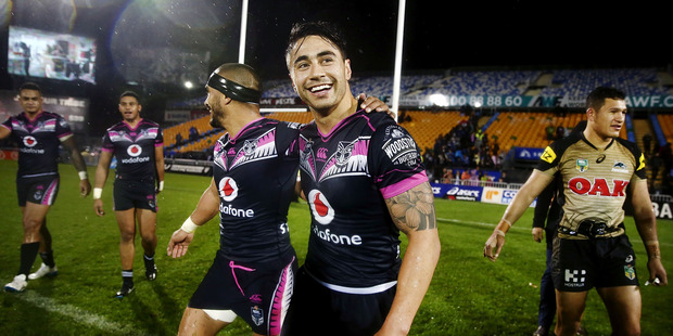 Shaun Johnson of the Warriors is mobbed by teammates after scoring the winning try to win the match in golden-point period. Photo / Getty Images.