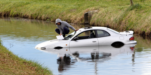 The teen prepares to jump from his car. Photo: Paul Taylor