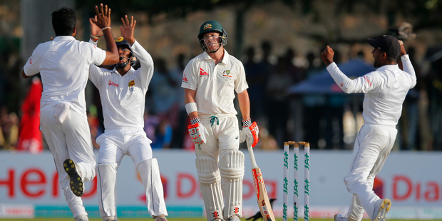 Australia's David Warner looks on after being dismissed. Photo / AP