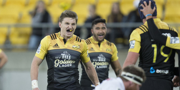 Hurricanes first five-eighths Beauden Barrett and his team mates jubilant after winning a penalty against the Chiefs. photo / Mark Mitchell.