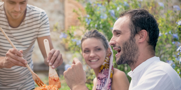 Having a crack at a foreign language is great fun and adds to your travel experience. Photo / iStock