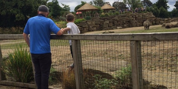 A boy was pictured standing in a rhino enclosure at Dublin Zoo. Photo / @Adriannasss Twitter