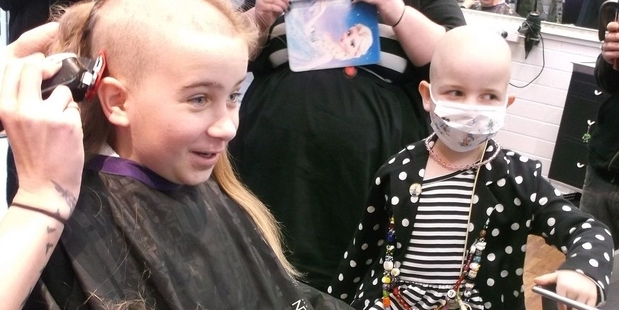 Caelan (left) with her younger sister Mileka.