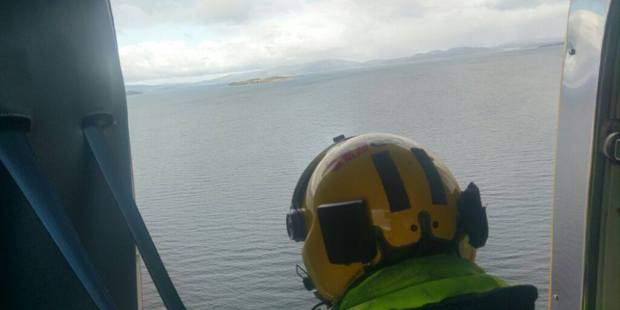 Searchers look for the missing boaties last week. Photo / Supplied