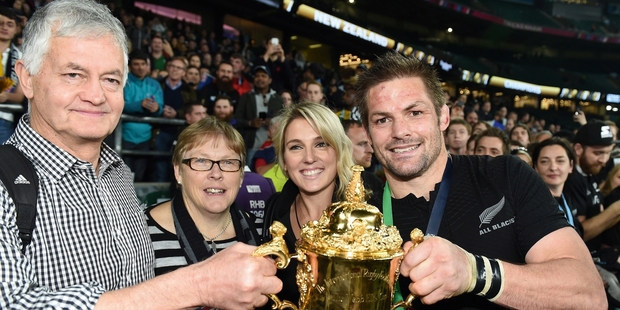 Richie McCaw and partner Gemma Flynn celebrate the winning of the Rugby World Cup with family. Photo / Photosport