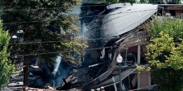 The two buildings at Maryland resembled the site of a bomb blast with a gaping hole left in them. The flames that followed created a desperate scene. Photo / AFP