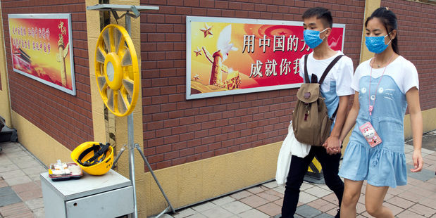 A Chinese couple in Beijing. Divorce rates in China are soaring, with more than 3.6 million last year. Photo / AP