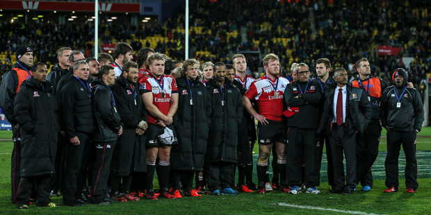 Lions players and staff stand dejected after the 2016 Super Rugby final last night. Photo / Getty Images