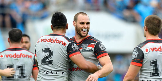 Simon Mannering of the Warriors celebrates victory with his team mates against the Titans. Photo / Getty Images