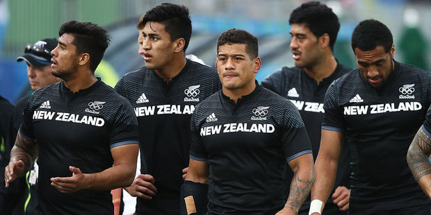 New Zealand sevens players look dejected after a loss at the Olympics. Photo / Getty