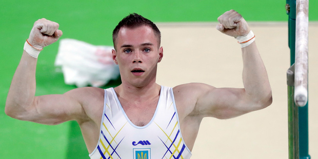 Ukraine's Oleg Verniaiev celebrates after his routine on the parallel bars during the artistic gymnastics men's team final at the 2016 Summer Olympics. Photo / AP