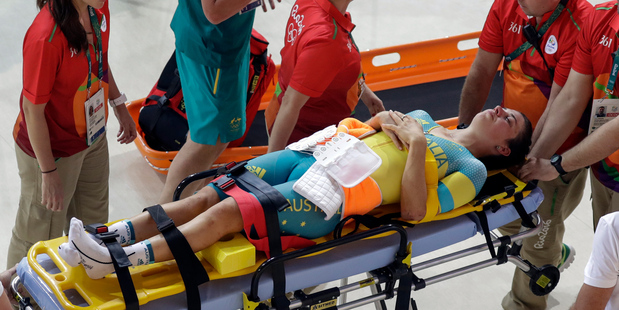 Australia's Melissa Hoskins is stretchered out of the Rio Olympic Velodrome following a training crash earlier today. Photo / AP