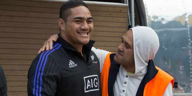 Ofa Tu'ungafasi poses for a photo with a fan during the All Blacks signing session at Aotea Square. Photo / Brett Phibbs