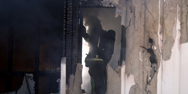 Whanganui fire fighters were called to a house fire near the intersection of Ingestre St and Harrison St on Thursday afternoon. Photo/ Stuart Munro