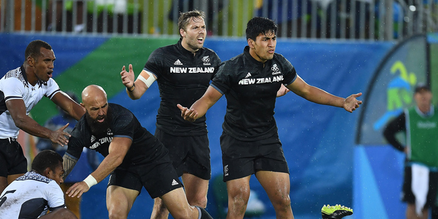 KEY MOMENT: New Zealand's Tim Mikkelson, centre, and Rieko Ioane, right, appeal Ioane's yellow card in the quarterfinal loss to Fiji. PHOTO/photosport 110816sp22BOP