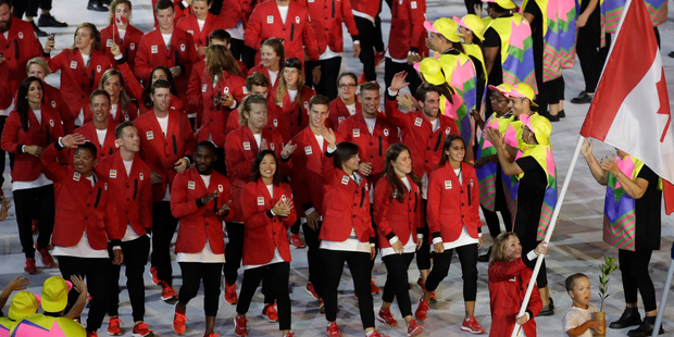 Rosannagh Maclennan carries the flag of Canada during the opening ceremony. Photo / AP