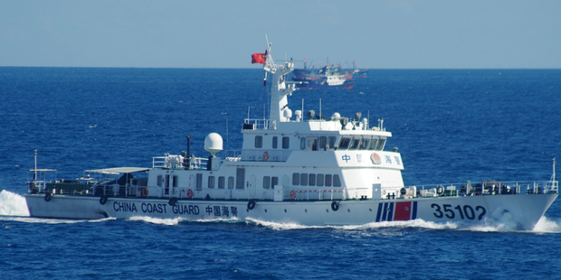 Japan's coast guard spotted the vessels on Saturday along with a fleet of 230 Chinese fishing boats swarming around the Japanese-controlled Senkaku Islands. Photo / AP
