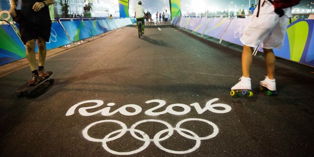 The Olympic rings decorate the finish line of the cycling road race. Photo / AP