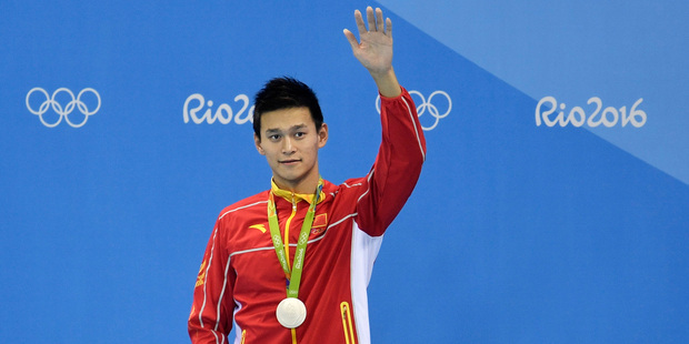 China's silver medal winner Sun Yang waves during the ceremony for the men's 400-meter freestyle final at the swimming competitions at the 2016 Summer Olympics. Photo / AP.