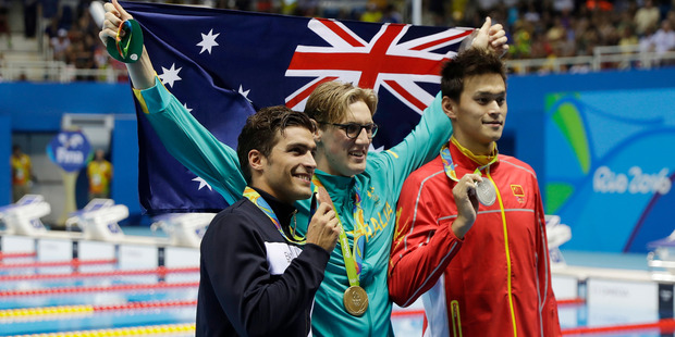 Winner Mack Horton, centre, thrid placed Italy's Gabriele Detti, left, and silver medallist Sun Yang from China hold their medals after the men's 400m freestyle final at Rio. Photo / AP