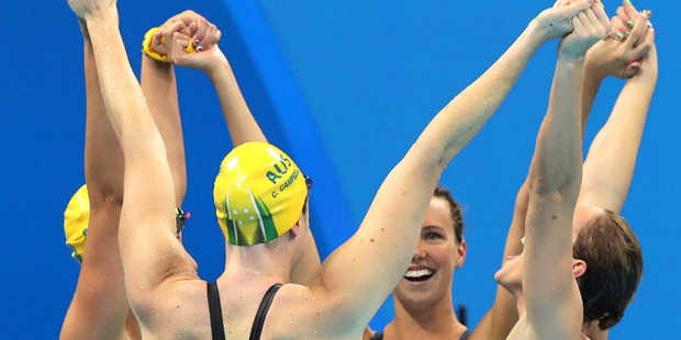 The world record-breaking Australian women's 4x100-metre freestyle relay team celebrate winning gold in Rio. Photo / AP