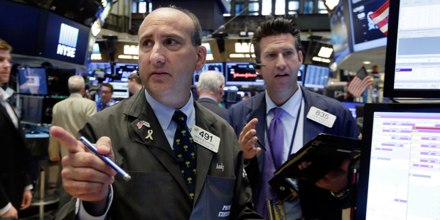 Traders work on the floor of the New York Stock Exchange. Photo / AP