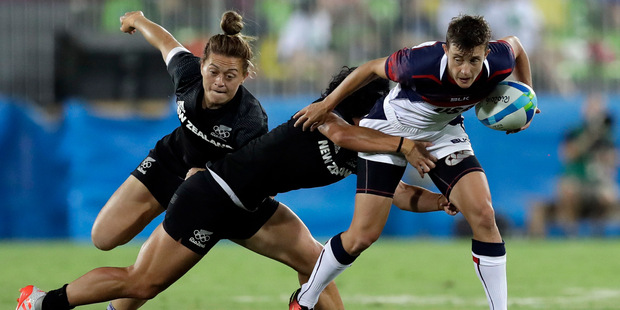 Olympic action: US' Jessica Javelet (right) is tackled by New Zealand's Portia Woodman during the women's rugby sevens quarter final. Photo / AP