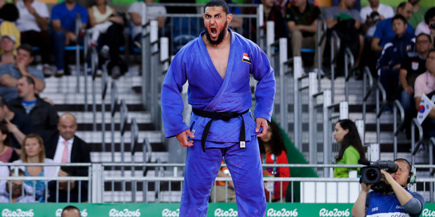 Egypt's Islam El Shehaby grimaces as he arrives to competes with Israel's Or Sasson. Photo / AP