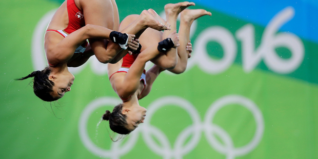 Roseline Filion and Meaghan Benfeito compete during the women's synchronized diving final at the Olympics in Rio de Janeiro. Photo / AP