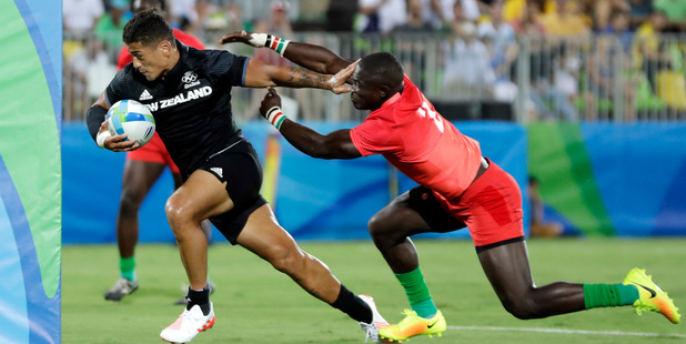 New Zealand's Augustine Pulu, left, avoids a tackle Kenya's Bush Mwale, to score a try during the men's rugby sevens match at the Summer Olympics in Rio. (AP Photo/Themba Hadebe)