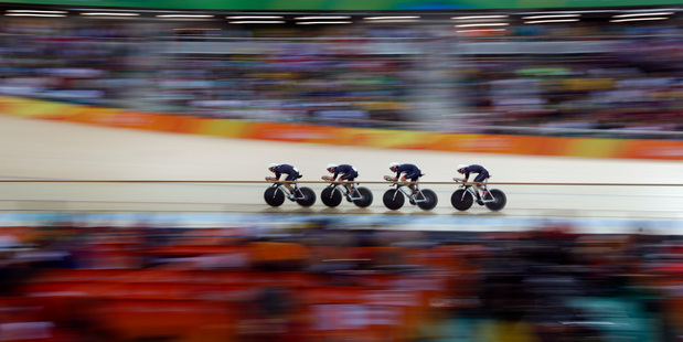Great Britain's team ride to win gold in the men's team sprint finals at the Olympics in Rio de Janeiro. Photo / AP