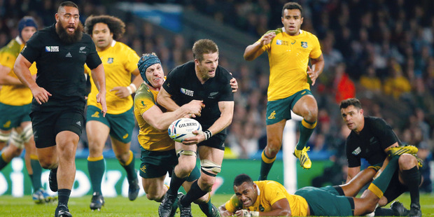Richie McCaw of New Zealand is tackled by David Pocock of Australia during the 2015 Rugby World Cup Final match. Photo / Getty Images