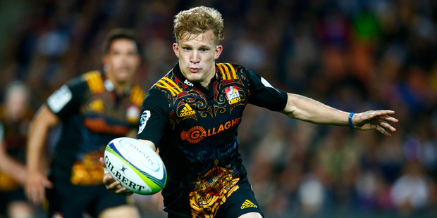 Damian McKenzie of the Chiefs runs the ball during the round 11 Super Rugby match between the Chiefs and the Highlanders. Photo / Getty Images.