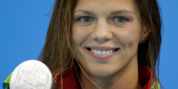Russia's Yulia Efimova shows off her silver medal during the medal ceremony for the women's 200-meter breastroke final. Photo / AP