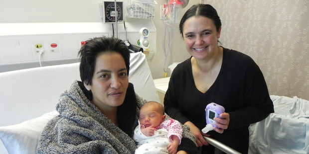 New mum Amy Paki with baby Marewa and midwife Natasha Rawiri with one of six carbon monoxide monitors being used throughout the BOPDHB's maternity departments. Photo/supplied