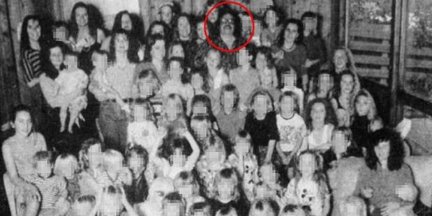 The cult leader, circled, was also convicted of throwing a plank of wood at the head of one of the children. Photo / AP