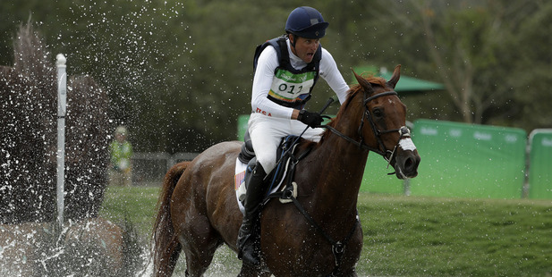 Boyd Martin, of the United States, competes on Blackfoot Mystery in the equestrian eventing cross country. photo / AP