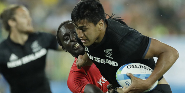Kenya's Humphrey Kayange, back, tackles New Zealand's Rieko Ioane. Photo / AP
