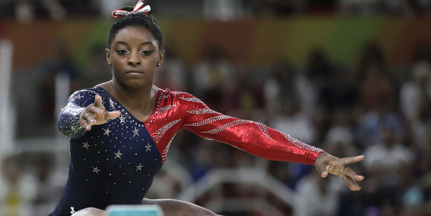 United States' Simone Biles performs on the balance beam. Photo / AP