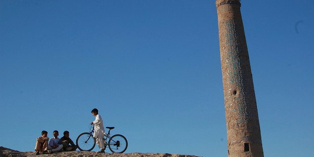 Children near a minaret in Herat. Photo / Flickr, Jim Kelly
