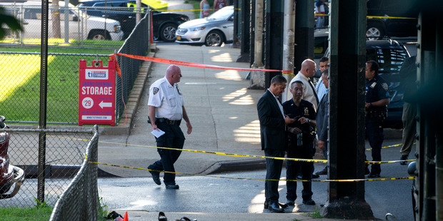 Sandals mark the crime scene not far from the Al-Furqan Jame Masjid Mosque in the Ozone Park neighbourhood of Queens, New York. Photo / AP