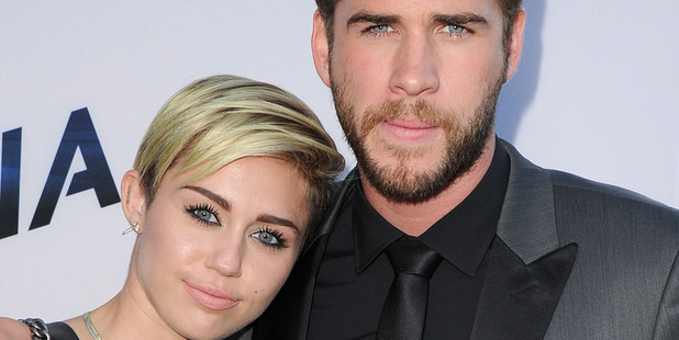 Miley Cyrus and Liam Hemsworth are reportedly looking for a new location for their honeymoon. Photo/Getty
