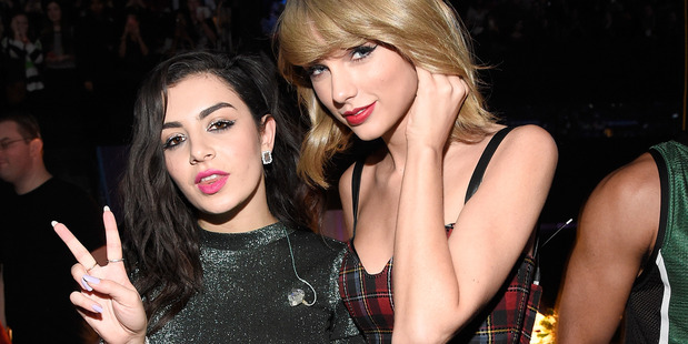 Charli XCX and Taylor Swift pose backstage at iHeartRadio Jingle Ball 2014. Photo / Getty