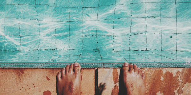 If you've ever felt your eyes burn and go red when you're near a pool, there's a high chance someone has urinated in it. Photo / Getty