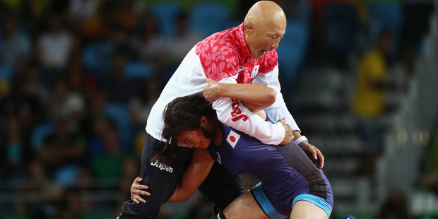 Her 56-year-old coach Kazuhito Sakae is a retired wrestler. Photo / Getty Images