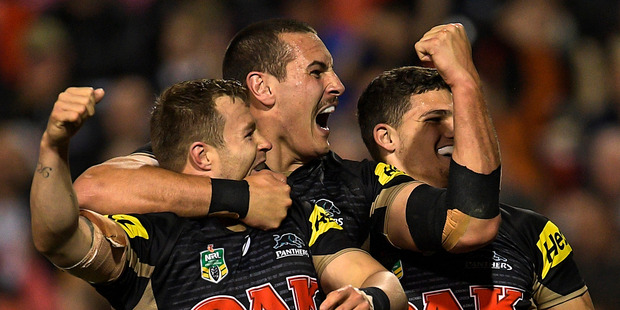 Panthers forward Trent Merrin celebrates scoring a try during his side's big win over the Wests Tigers on Friday night. Photo / Getty Images