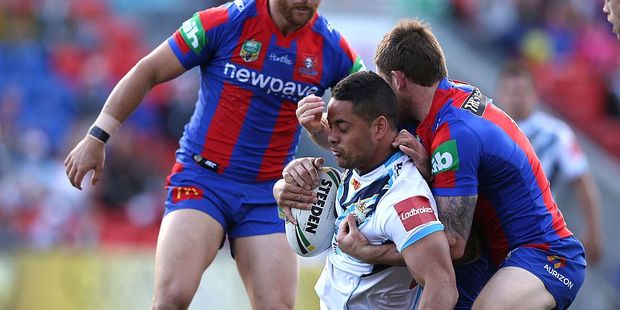 Jarryd Hayne of the Titans is tackled during the round 24 NRL match between the Newcastle Knights and the Gold Coast Titans. Photo / Getty Images