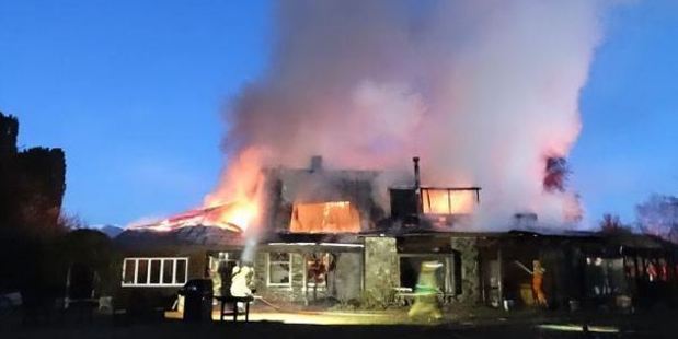 Historic Cluden Station homestead in Tarras is consumed by fire last night. Photo: Mark Price / Otago Daily Times
