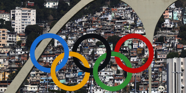 The Olympic Rings are seen with favelas in the background. Photo / Getty Images