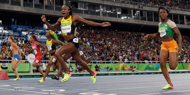 Jamaica's Elaine Thompson celebrates after winning gold in the women's 100-metre final. Photo / AP